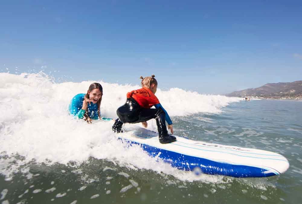Child learning to surf