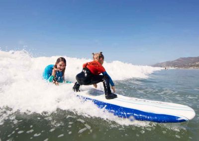 Child learning to surf